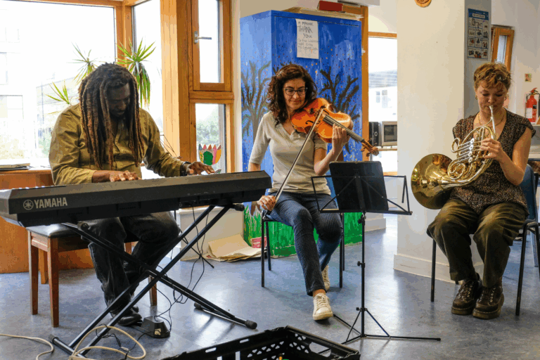 Aga Serugo-Lugo and LPO players during a music workshop at our centre