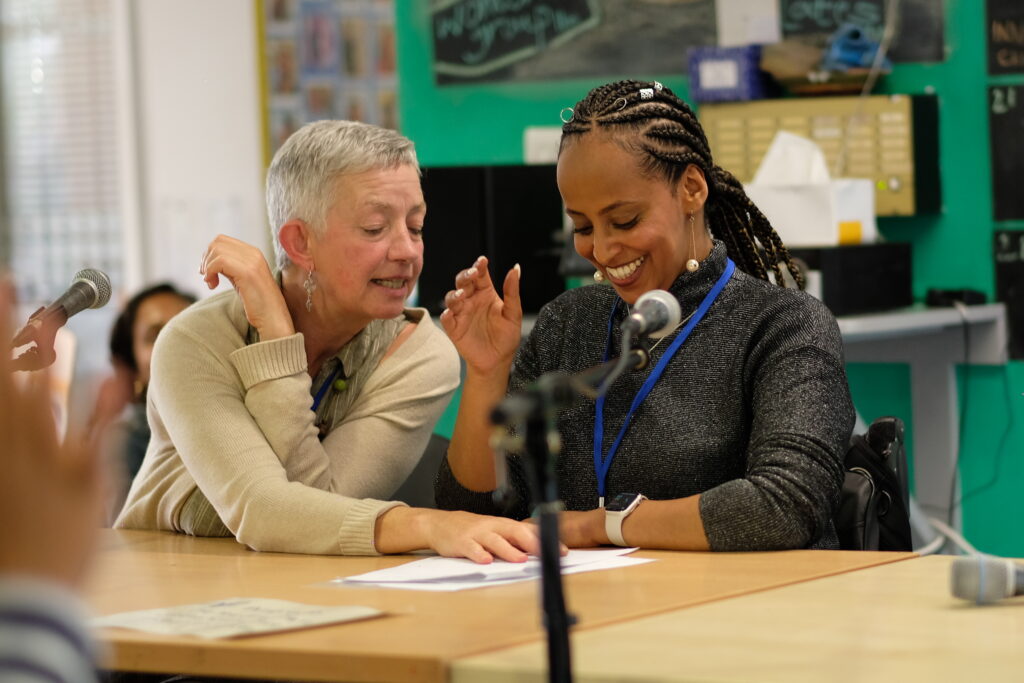 Two members of Headway discussing research topics to support people living with brain injury